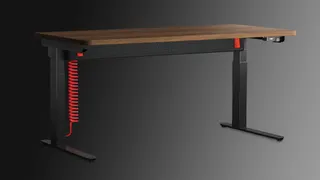 A Herman Miller Coyl gaming desk on a grey background.