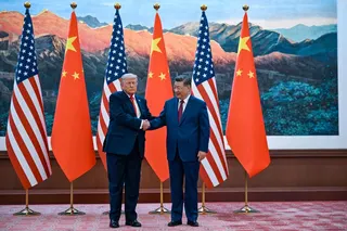 US President Donald Trump (right) shakes hands with China’s President Xi Jinping at the Great Hall of the People in Beijing. — AFP pic