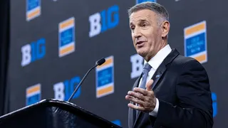 Big Ten Commissioner Tony Petitti speaking at Lucas Oil Stadium in Indianapolis