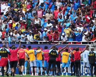 The Democratic Republic of the Congo team celebrate with fans after securing World Cup qualification in Guadalajara on 31 March.