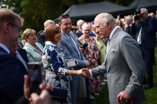 Britain’s King Charles (right) attends a garden party at Hillsborough Castle in Northern Ireland on Wednesday. Photo: AFP