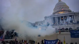 Tear gas is fired at supporters of President Trump who stormed the United States Capitol building. (Photo by Evelyn Hockstein/For The Washington Post via Getty Images)