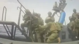 Global Sumud Flotilla/Handout via Reuters Video footage from the Global Sumud Flotilla showing armed commandos boarding a sailboat from a raiding craft in the Mediterranean, west of Cyprus (18 May 2026)