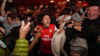 Arsenal players, including Bukayo Saka, celebrate winning the Premier League