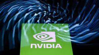 NurPhoto via Getty Images A laptop keyboard and Nvidia logo displayed on a phone screen are seen in this multiple exposure illustration photo
