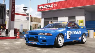 Forza Horizon 6 Series 1: The 1990 Nissan #12 Skyline GT-R (BNR32 Gr.A) JTC parked at a gas station.
