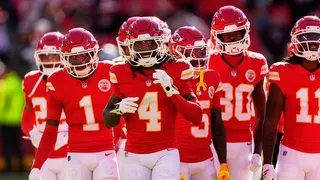 Kansas City Chiefs wide receiver Rashee Rice warming up on the field with teammates