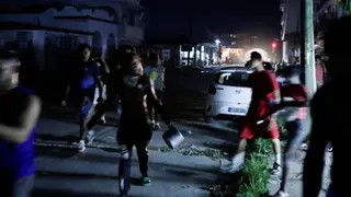 Reuters Dozens of protesters carrying pots and pans run through the streets of Havana at night in protest of recent energy shortages.