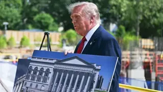 US President Donald Trump speaks to the press near the construction site of his proposed ballroom.