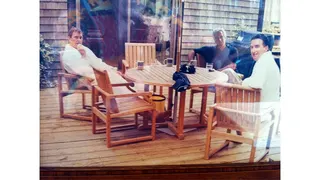 Andrew Mountbatten-Windsor and Lord Peter Mandelson seated wearing bathrobes with Jeffrey Epstein