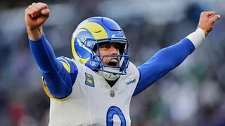 Los Angeles Rams quarterback Matthew Stafford throwing a football during a game.