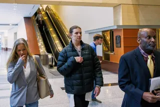 Aimee Bock, centre, founder and executive director of the charity Feeding Our Future. Photo: Minnesota Public Radio via AP