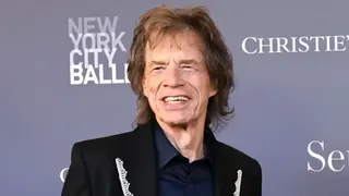 Getty Images Mid-shot of Sir Mick Jagger, wearing a lace lapelled suit jacket