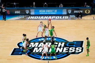 Southern California forward Evan Mobley (4) fights for the opening tipoff with Oregon guard LJ Figueroa (12) during the first half of a Sweet 16 game in the NCAA men's college basketball tournament, March 28, 2021, in Indianapolis. (AP Photo/Darron Cummings, File)