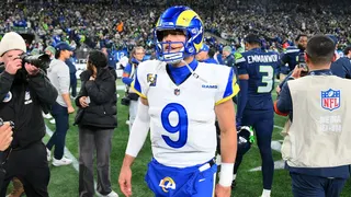 Los Angeles Rams quarterback Matthew Stafford walking off the field at Lumen Field.