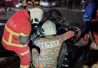 Three men were killed while a woman was seriously injured after the car they were travelling in crashed into the rear of a cement lorry at KM34 of the Kuala Lumpur-bound Karak Highway near Kampung Sungai Chinchin early today. Pic courtesy of Fire Department