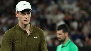 Jannik Sinner and Novak Djokovic react during their Australian Open semi-final