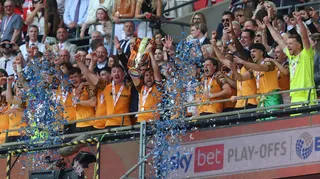Hull players lift the trophy after winning the Championship play-offs at Wembley