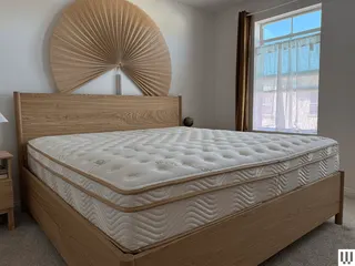 Image may contain: Furniture, Indoors, Interior Design, Bed, and Mattress
