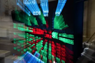 A monitor displays market information on the floor of the New York Stock Exchange.