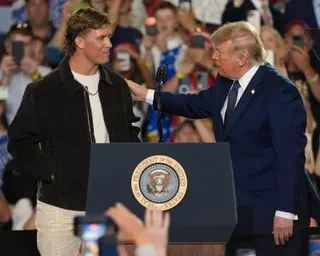 Giants quarterback Jaxson Dart introduces Donald Trump at a rally in New York on Friday.