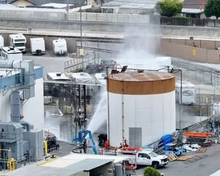 Water sprayed on chemical tank