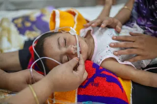 A child receives treatment after showing measles-like symptoms at Dhaka North City Hospital (DNCC) in Mohakhali, Bangladesh on May 6, 2026.