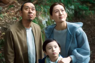 A couple (played by Haruka Ayase, right, and the mononymous Daigo) struggling to come to terms with the death of their son welcome a humanoid (Rimu Kuwaki, center) modeled after their child in “Sheep in the Box.”