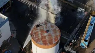 Reuters A drone picture shows water being sprayed on a tank as a chemical incident involving a failing tank of flammable liquid called methyl methacrylate, used in the aerospace industry, has forced an evacuation in the surrounding area in Garden Grove, California.