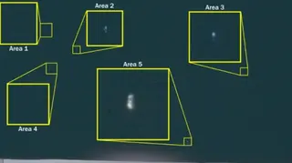 US Department of Defense A black sky with little white dots that are highlighted inside yellow boxes