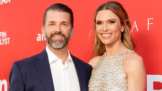 Donald Trump Jr. and Bettina Anderson standing together at an event.