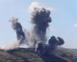 Large plumes of smoke rise from southern Lebanon hillsides following Israeli strikes