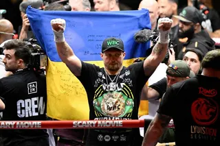 Ukraines Oleksandr Usyk celebrates after defeating Netherlands Rico Verhoeven (off frame) by TKO during their WBC World Heavyweight Championship 'Glory in Giza' boxing match at the Pyramids of Giza on May 23, 2026. Heavyweight boxing king Oleksandr Usyk retained his titles after a dramatic and controversial stoppage victory over kick-boxer Rico Verhoeven with a second left of the 11th round in Egypt on May 23. (Photo by Khaled DESOUKI / AFP)