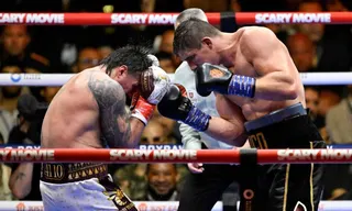 Ukraine's Oleksandr Usyk (L) fights Netherlands' Rico Verhoeven (R) during their WBC World Heavyweight Championship 'Glory in Giza' boxing match at the Pyramids of Giza on May 23, 2026. Heavyweight boxing king Oleksandr Usyk retained his titles after a dramatic and controversial stoppage victory over kick-boxer Rico Verhoeven with a second left of the 11th round in Egypt on May 23. (Photo by Khaled DESOUKI / AFP)
