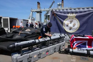 UK Royal Navy personnel inspect autonomous vehicles with sonar sensor that can detect and identify mines, on RFA Lyme Bay in territory of Gibraltar, on Friday, May 22, 2026. (AP Photo/Kwiyeon Ha)