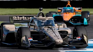 Felix Rosenqvist driving car number 60 through a turn at Indianapolis Motor Speedway.