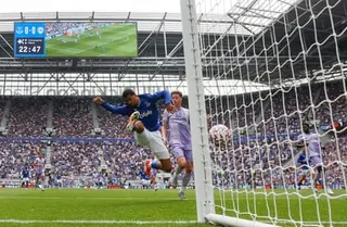 Iliman Ndiaye of Everton scores the first goal at the Hill Dickinson Stadium.
