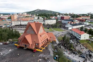 On a specially designed trolley with 224 wheels, Kiruna Church, is moved at a speed of half a kilometer per hour, during a relocation in Kiruna, Sweden, August 19, 2025.