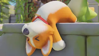 A stuffed dog falls over a wall.