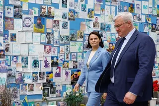 Belarusian opposition leader Sviatlana Tsikhanouskaya and Ukrainian Foreign Minister Andrii Sybiha at the Wall of Remembrance of the Fallen Defenders of Ukraine, St Michael’s Cathedral, Kyiv, Ukraine on Sunday. Photo: Reuters