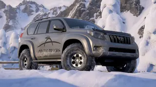 Forza Horizon 6 Series 1: The 2016 Toyota Land Cruiser Arctic Trucks AT37 parked on a snow-covered hill.