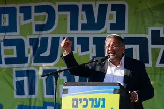 Israeli far-right minister Itamar Ben Gvir delivers a speech during a gathering by right-wing activists near the border with Gaza on October 21, 2024, calling to establish a new Jewish settlement in the Gaza Strip. Photo: AFP
