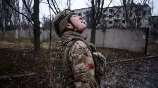 A Ukrainian serviceman checks the sky for fpv-drones in the frontline town of Kostyantynivka, Donetsk region, amid the Russian invasion of Ukraine. taken in 2025