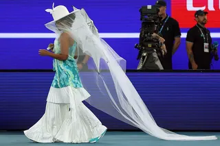 Japan's Naomi Osaka arrives wearing a Robert Wun designed outfit to face Croatia's Antonia Ruzic