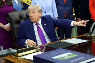 US President Donald Trump points out a member of the press during an event in the Oval Office on May 11. Photo: Getty Images/TNS