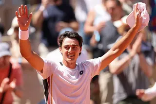 Adam Walton of Australia celebrates victory against Daniil Medvedev during the Men's Singles first round match during Day Three of the 2026 French Open at Roland Garros