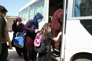 Members of Australian families believed to be linked to the Islamic State militants leave Roj camp near Derik, Syria April 24, 2026. — Reuters pic