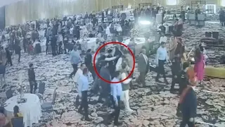 Screengrab from a CCTV video showing the moment a man aims gun at former Kashmir chief minister Farooq Abdullah.