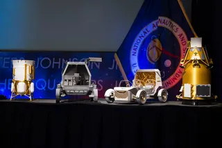 Models of upcoming NASA rovers on display at a May 26th, 2026 press conference