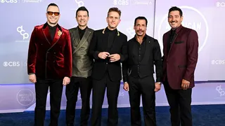 Donnie Wahlberg, Jordan Knight, Joey McIntyre, Danny Wood and Jonathan Knight standing together at the American Music Awards